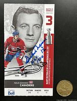 Front of ticket showing player graphics and both autographs