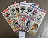 Four uncut sheets fanned out showing overall lot