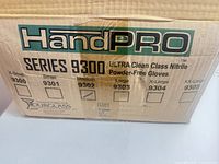 Cardboard case labeled HandPRO Series 9300 ULTRA Clean Class Nitrile Powder-Free Gloves with size chart