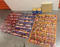 Overall lot with three posters, two coffee canisters, boxed tea