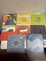 All eight records laid out showing front sleeves