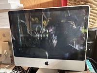 Front view of Apple iMac with screen and Apple logo visible