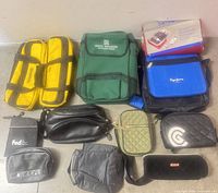 Group shot of all 11 bags and Samsonite box