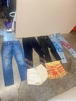All six denim items laid out together