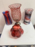 Four vases grouped on tabletop