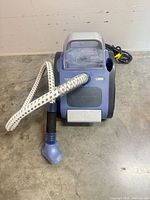 Front view of Rowenta steamer showing hose, nozzle and housing