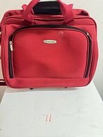 Front view showing Sonoma logo, front zip pocket, red fabric