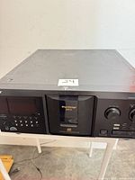 Front view of Sony MegaStorage 300-disc CD changer showing display, controls and loading door