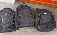 Front view of three backpacks: Osprey, Swiss, OGIO