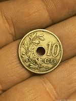 Obverse of 1906 holed 10 cents coin showing wreath and denomination