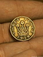Obverse side of 1939 threepence coin showing design and date