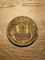 Reverse showing 2 FRANCS, date 1940, motto and floral design