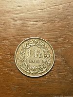 Obverse of 1945 Swiss 1 Franc silver coin showing denomination and wreath