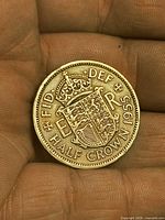 Reverse of 1955 half crown showing crowned shield and legend