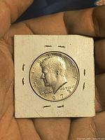 Obverse of 1973 Kennedy half dollar in 2x2 flip