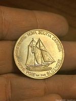 Obverse showing schooner and inscriptions
