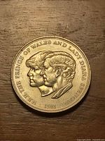 Obverse showing Prince Charles and Lady Diana profiles with 1981 date and inscription