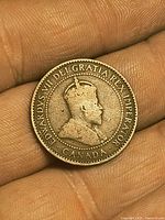 Obverse of 1906 Edward VII Canadian large cent held in hand