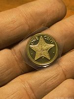 Starfish reverse with ONE CENT text, sealed in plastic