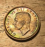 Obverse of 1949 Canadian 1 cent, King George VI, rainbow toning