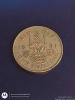 Reverse side showing crowned lion and crown, date 1951, denomination ONE SHILLING