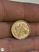 Reverse: crowned rose with thistle, shamrock, leek, legend ‘SIX PENCE 1966’