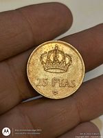 Reverse showing royal crown, 25 PTAS value and star mintmark