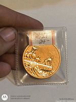 Obverse view in sleeve, soldiers in boat design