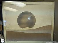 Front view of framed artwork showing sun and dunes design