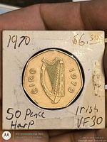 Obverse showing harp, Éire, date 1970 in cardboard holder