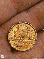 Reverse side showing men’s hockey design and inscriptions