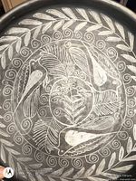 Interior view showing bird and foliage sgraffito design and swirl border