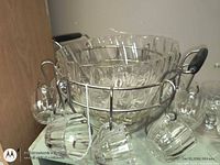 Punch bowl on stand with cups hanging