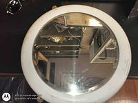 Front view of round mirror showing frame and glass