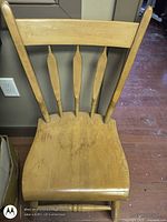 Front view of solid maple chair showing backrest, seat, legs