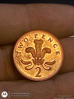 Reverse showing denomination and Prince of Wales feathers