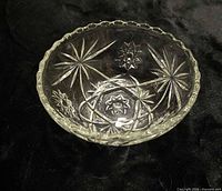 Oblique view of bowl showing scalloped rim and starburst pattern