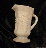 Side view showing grape relief and handle