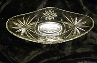 Top view of clear pressed glass bowl showing starburst pattern