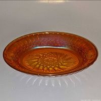 Top view showing marigold iridescence and starburst base