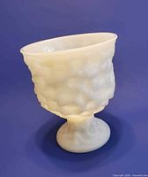 side view showing crinkle texture and pedestal base