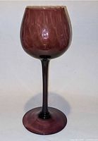 Full view of purple art glass goblet showing color, shape and long stem