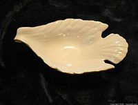 Top view of Lenox ivory porcelain dove bowl showing gold trim and interior