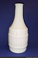 Full view of white milk glass bitters bottle