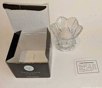 Holder, open box and care card displayed