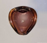 Top view of purple heart-shaped glass dish