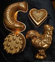 All four copper molds displayed together