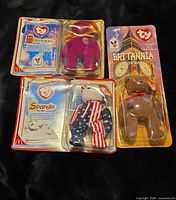 Front view of all three sealed bears: Britannia, Spangle, Millennium