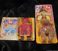 Front view of both sealed blister packs showing Millennium and Britannia bears