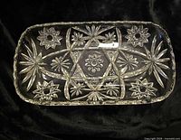 Top view of rectangular Star of David pressed glass tray